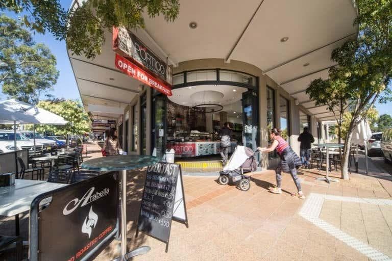 Shoppers and cafés along a street in Concord
