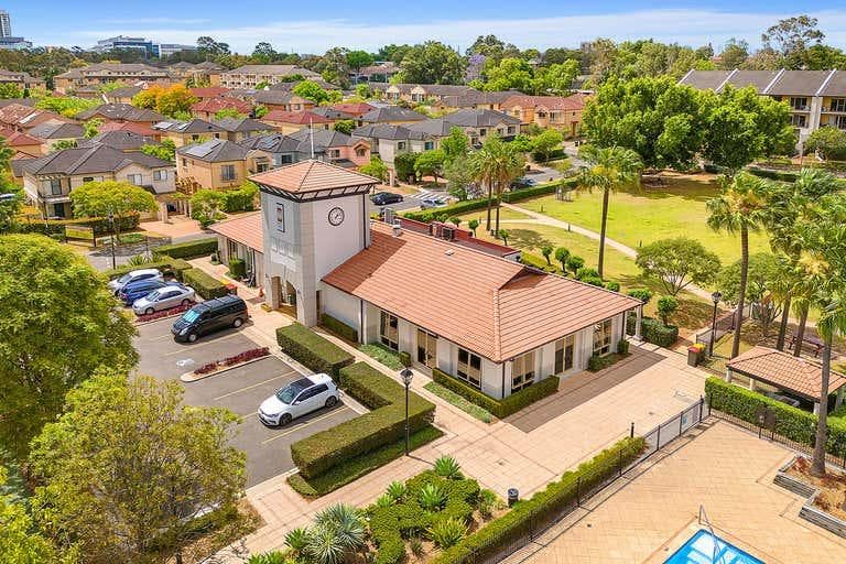 Aerial view of Liberty Grove with its village green, clubhouse and tennis courts